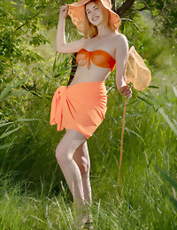 Cutie in orange bikini