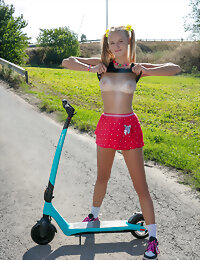 Nude teen on a scooter